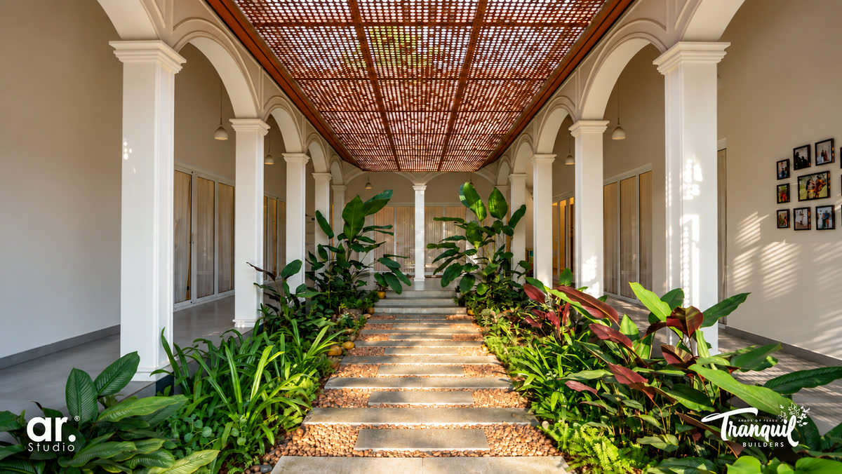 Ajish Residency, the colonnaded corridor lit through the pergola