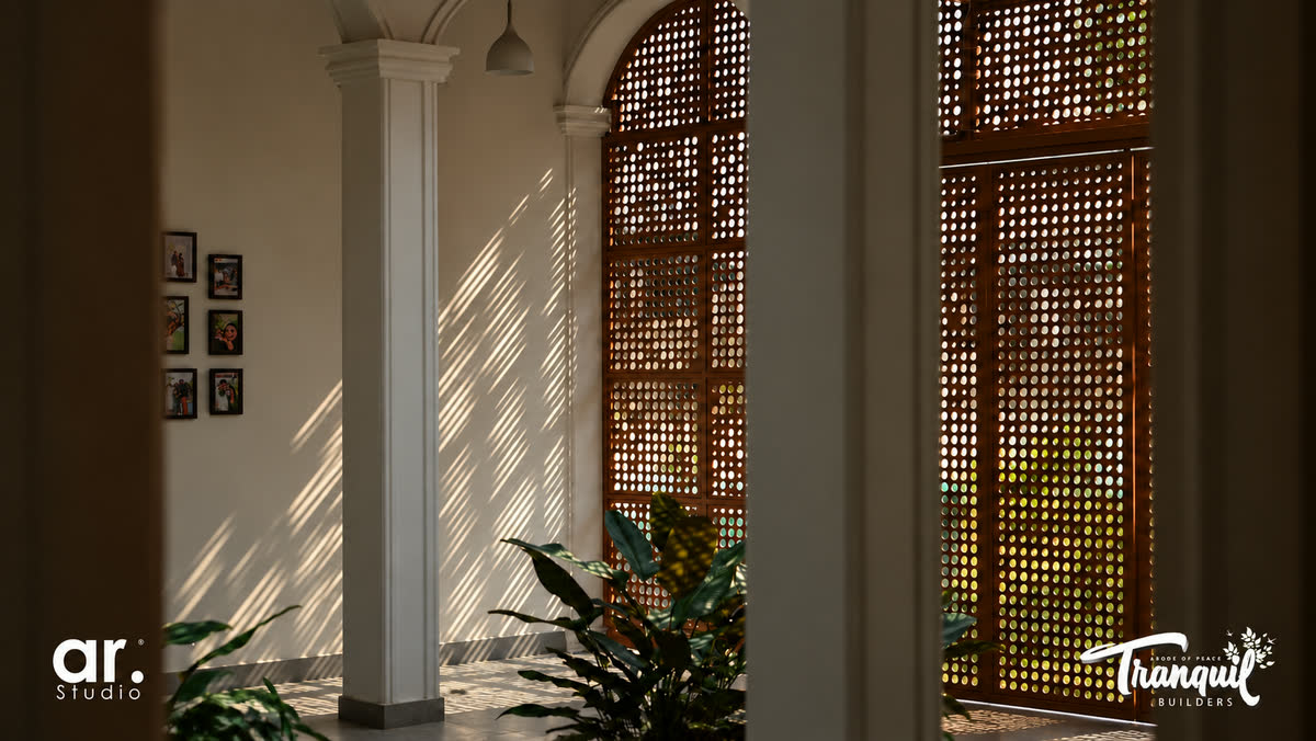 Ajish Residency — arched jali screens casting patterned light along the walk
