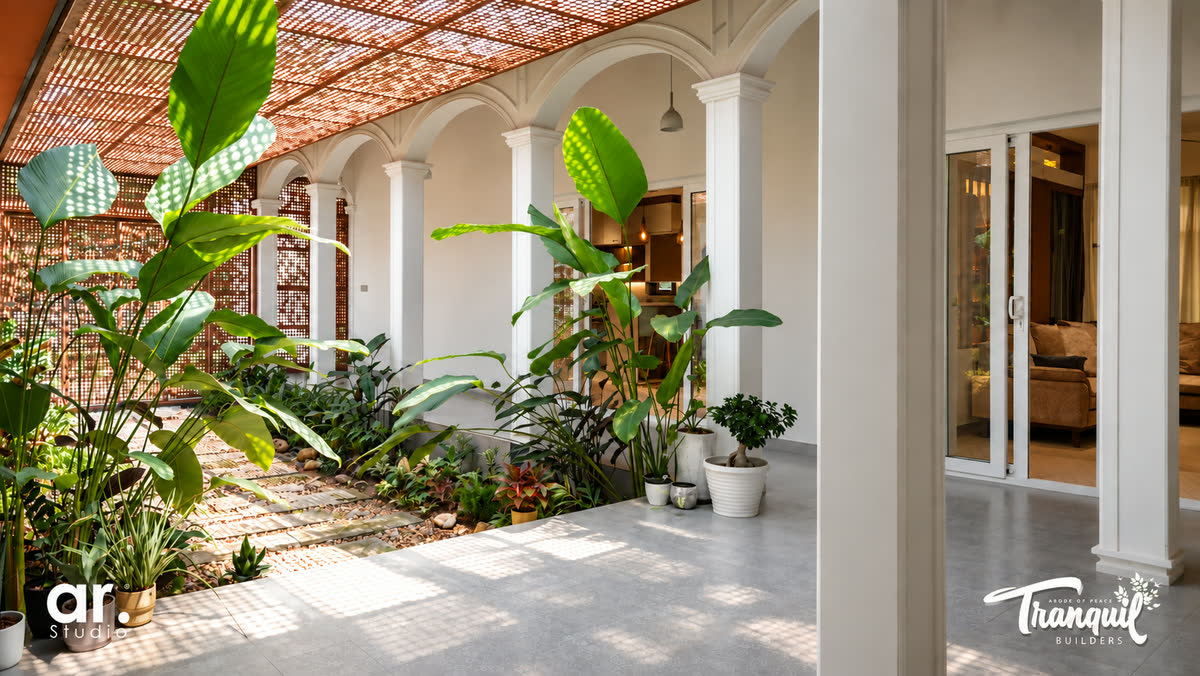 Ajish Residency — tropical planting against the courtyard arches
