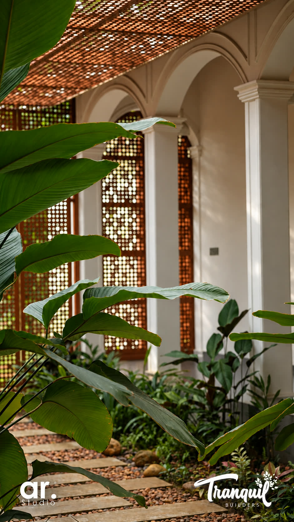 Ajish Residency — columns and greenery along the courtyard edge