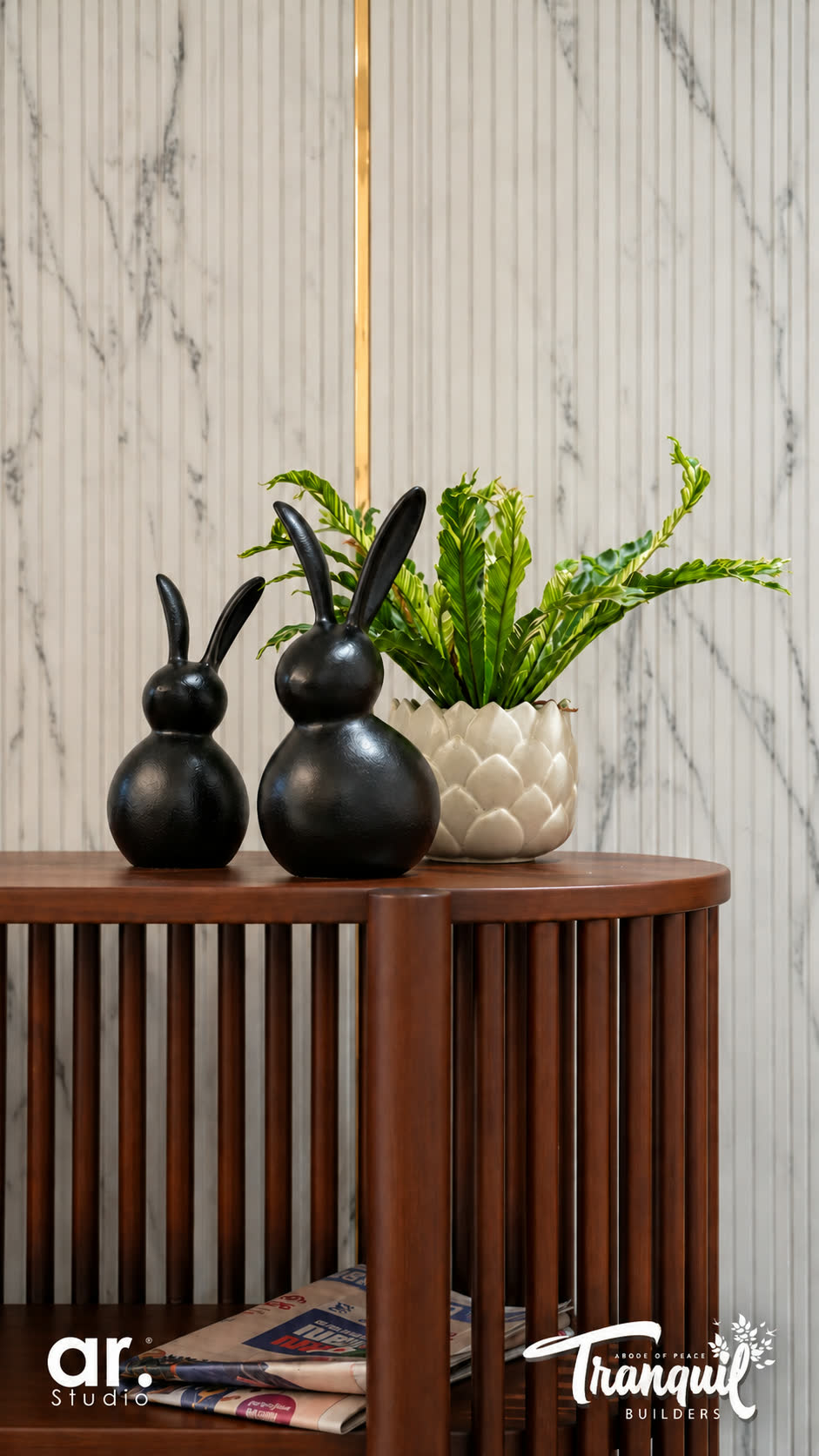 Ajish Residency — a console and vase against the marble