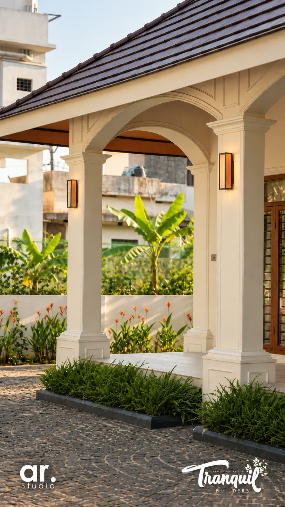 Ajish Residency — the arched entrance gate and planting