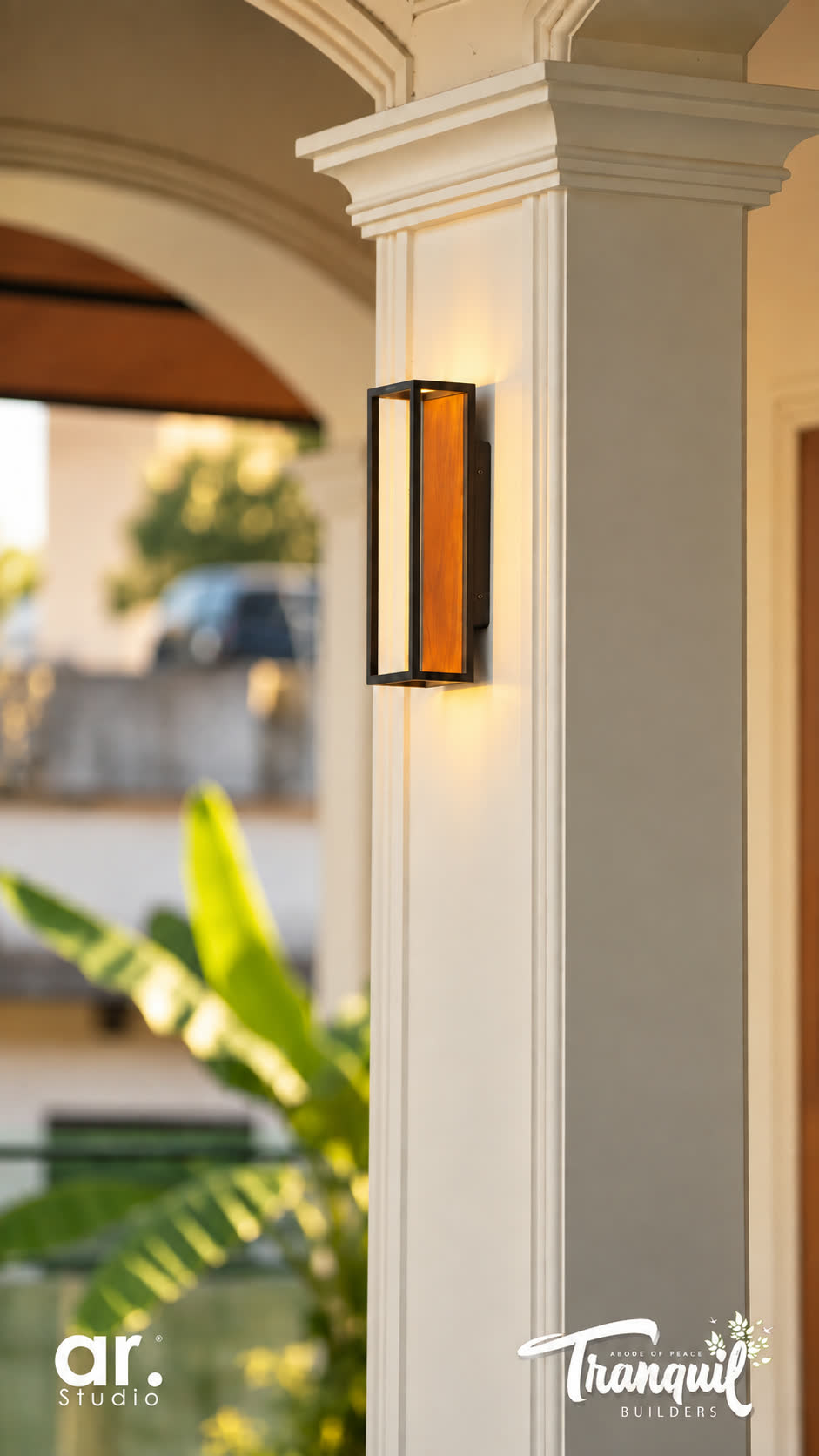 Ajish Residency — a column and lantern at the approach