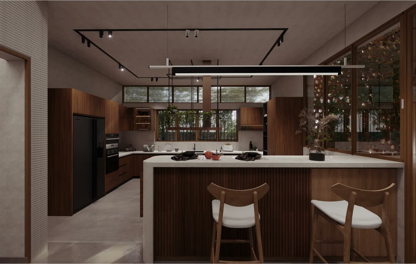 Prashandh Villa, the kitchen island beneath a linear pendant